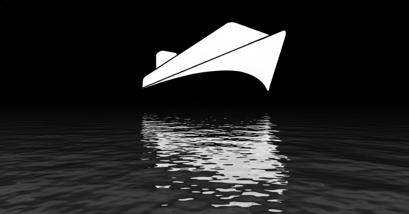 Paper ship over water